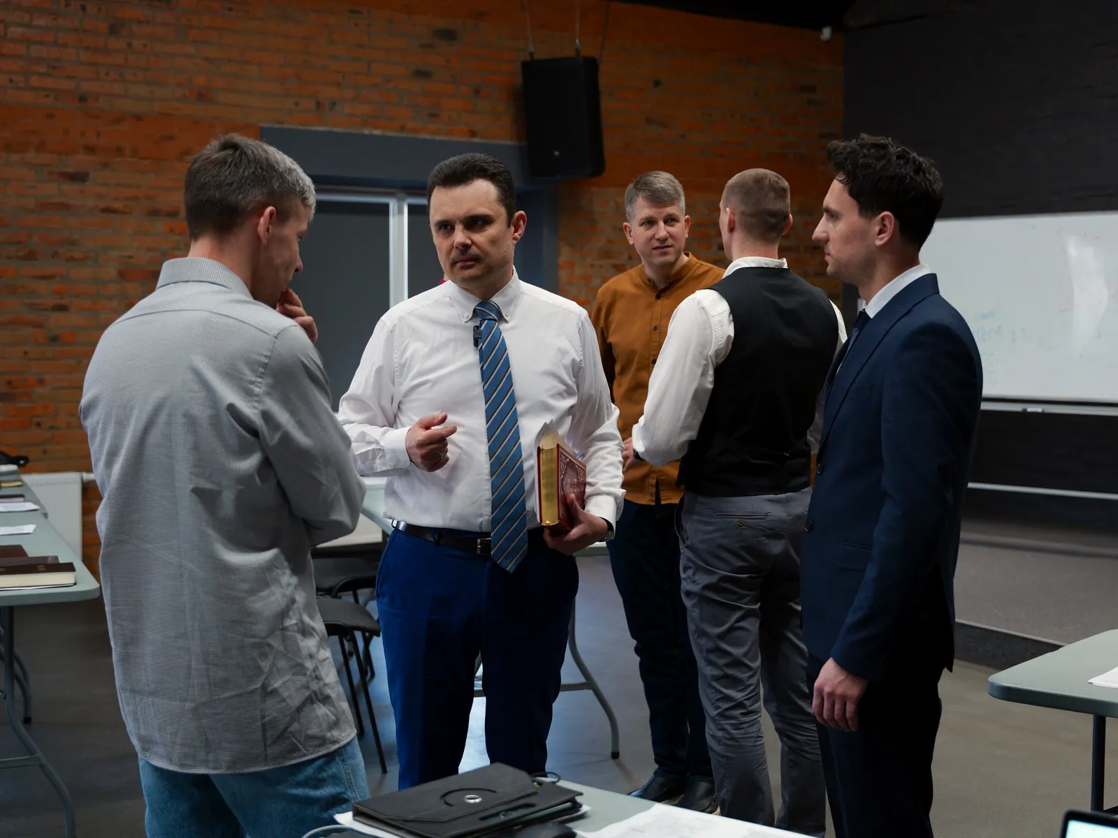 Teachers and students talking after class