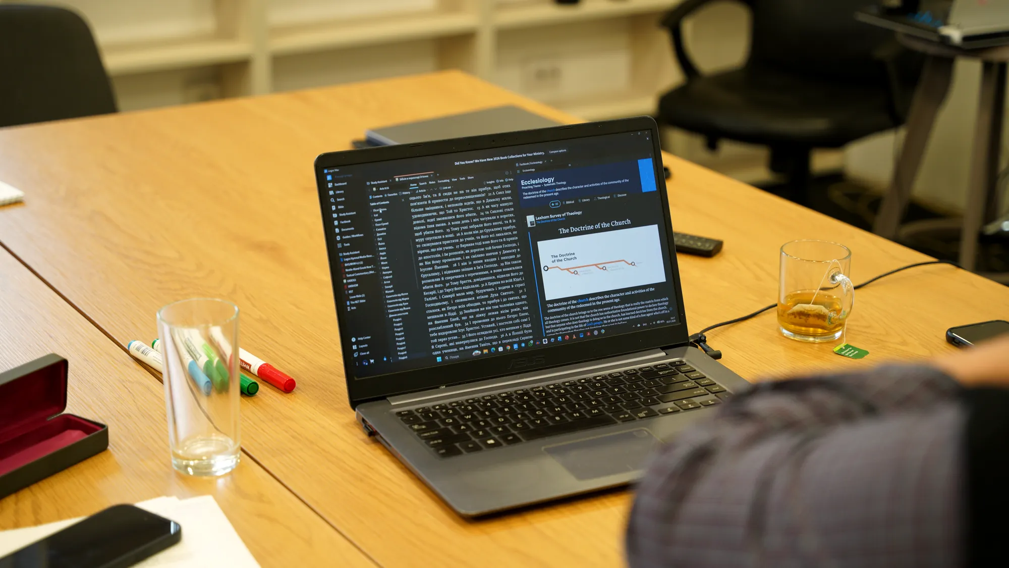 A laptop with theological study materials in class